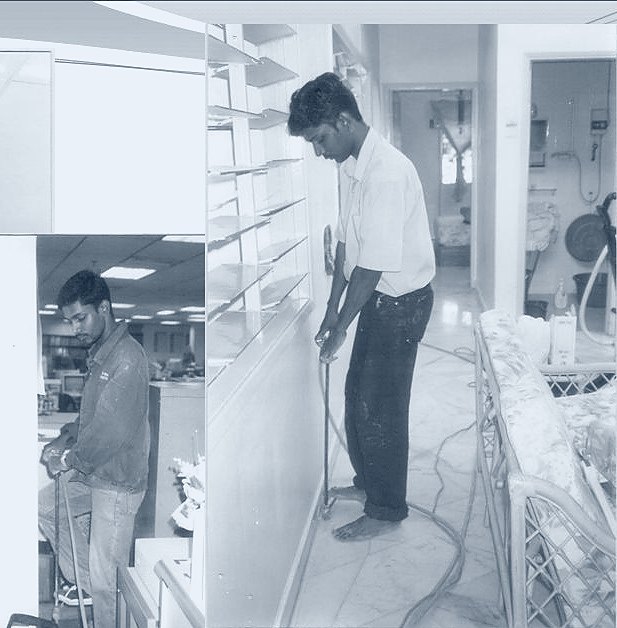Helang Rampai technician treating shelving inside a retail unit