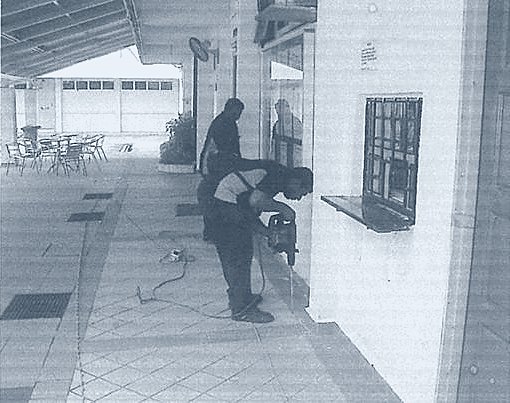 Helang Rampai technician fogging an open walkway